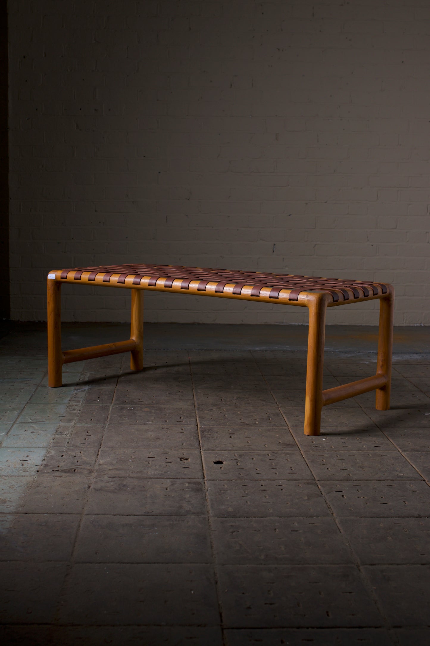 Leather strap round leg bench