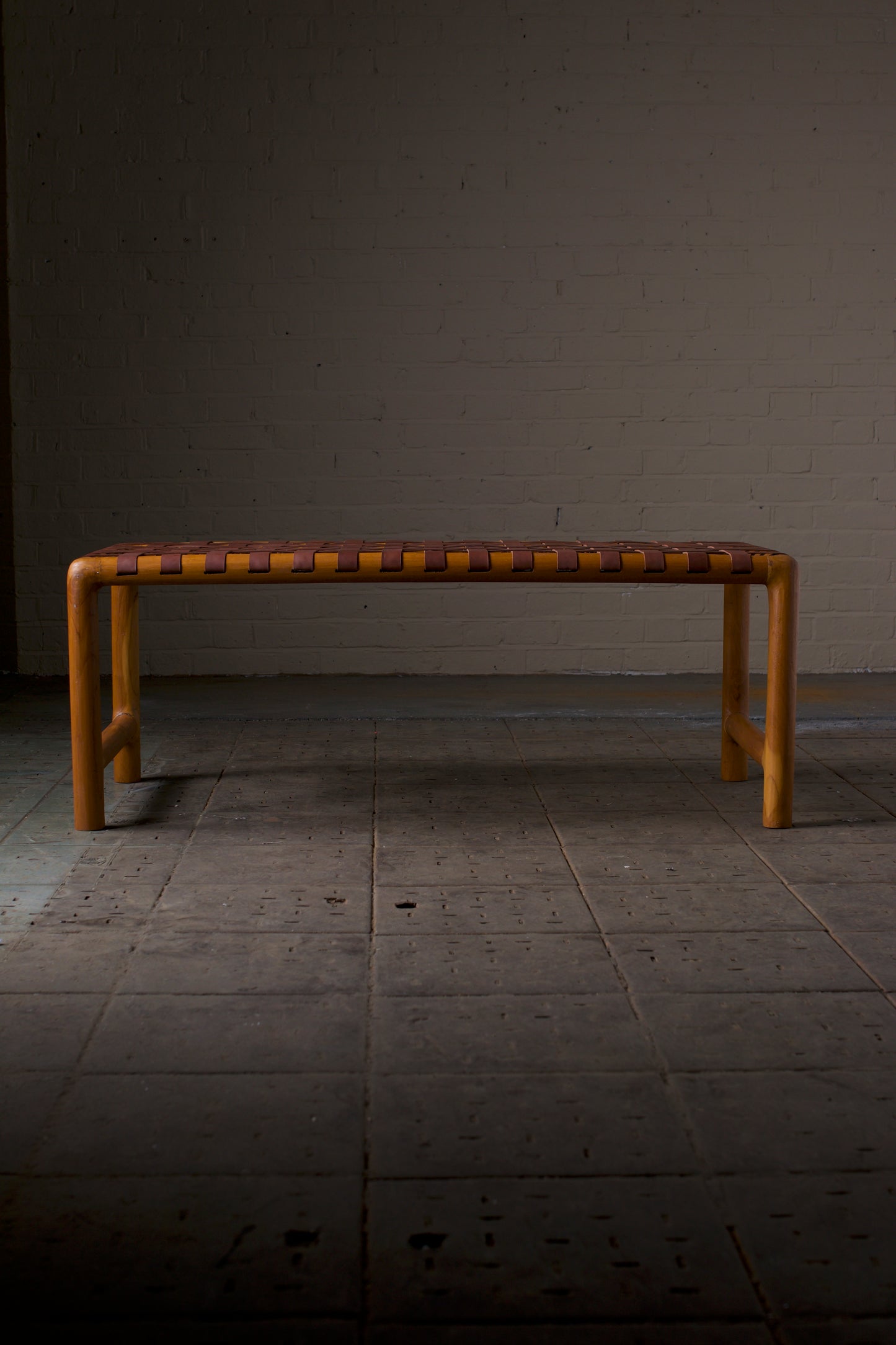 Leather strap round leg bench