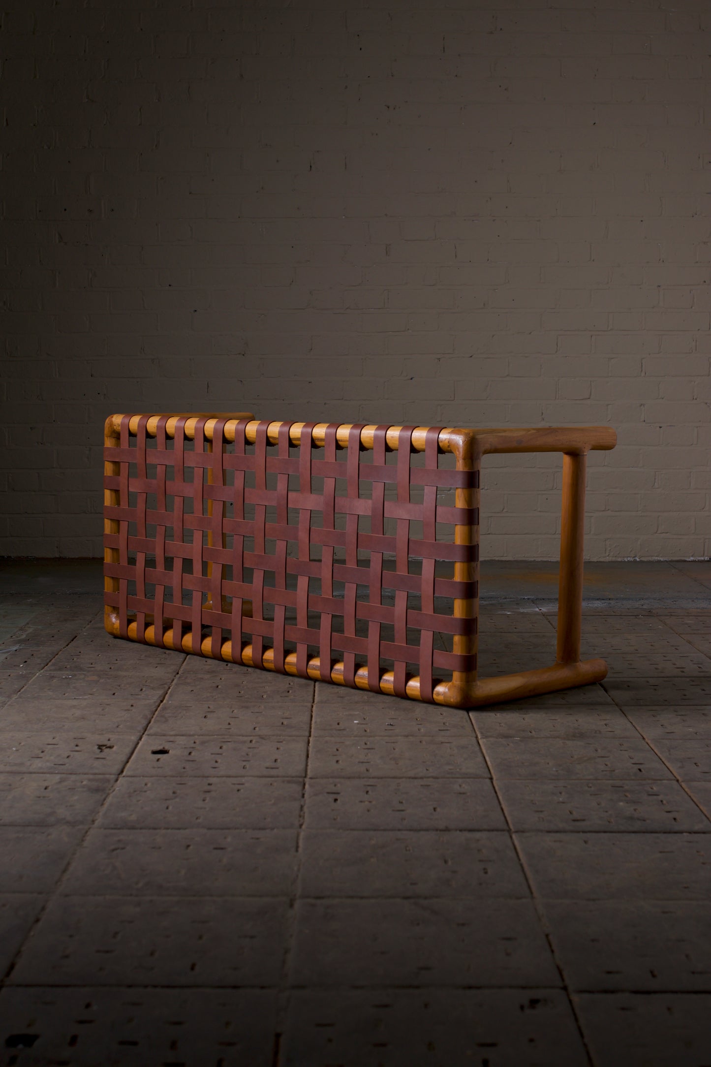 Leather strap round leg bench