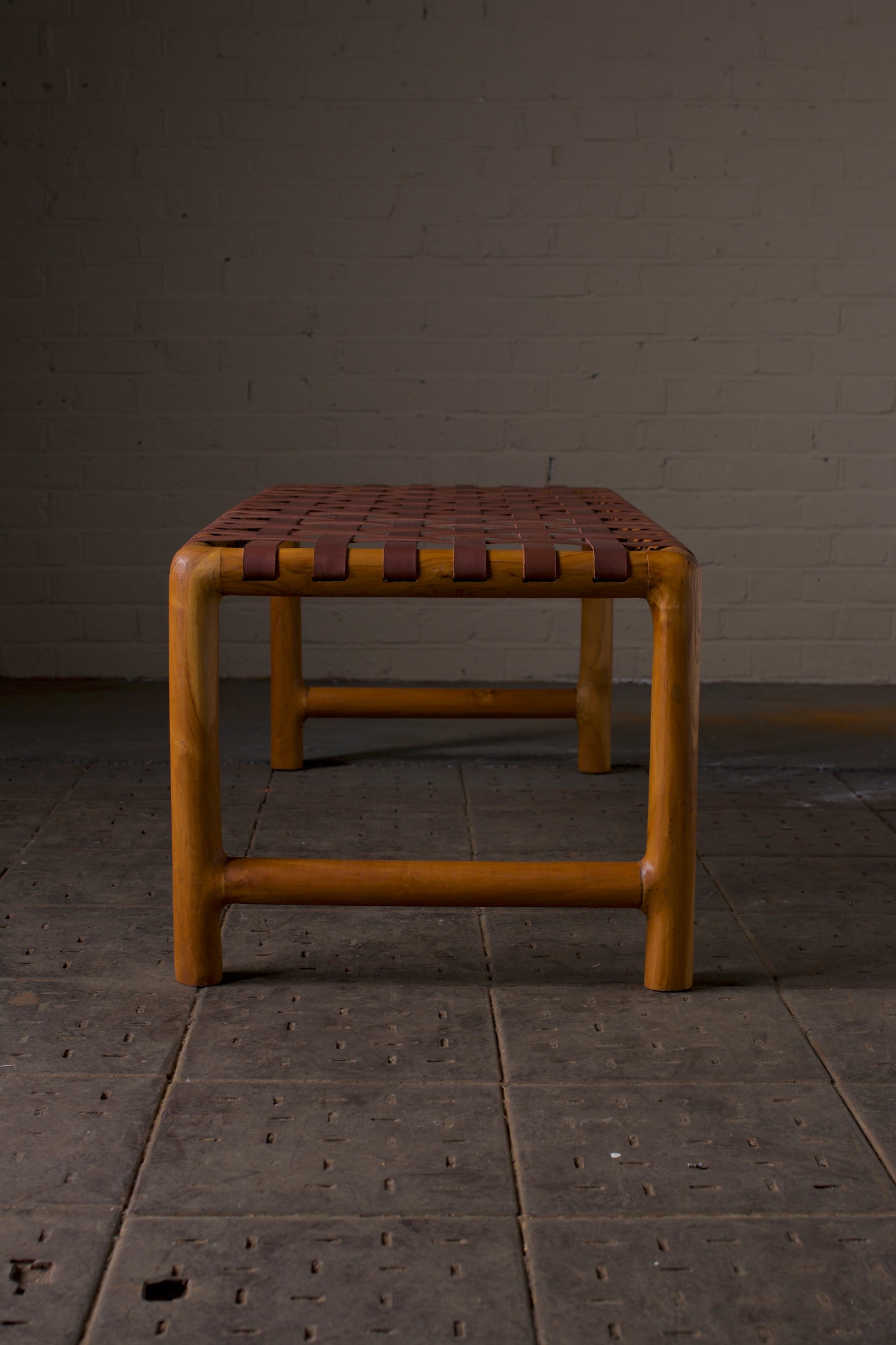 Leather strap round leg bench